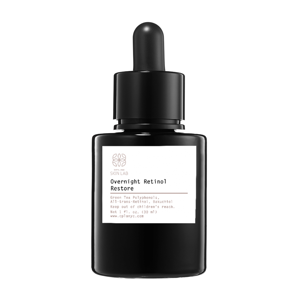 The image shows a bottle of overnight retinol serum with a dropper cap, placed on a surface against a white background.